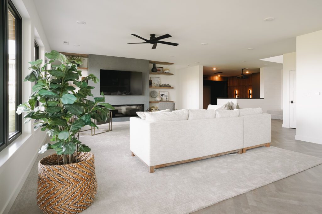 Household plant in woven basket to incorporate natural elements into living room. Living Room Cozy and Inviting
